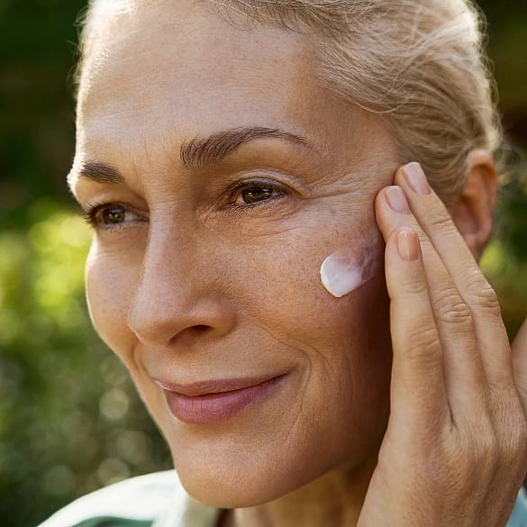 woman creaming face